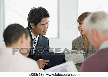 Stock Photo - Businesspeople in meeting. Fotosearch