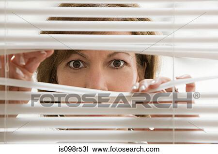 Businesswoman looking through blinds View Large Photo Image Stock Image - Businesswoman looking through blinds. Fotosearch