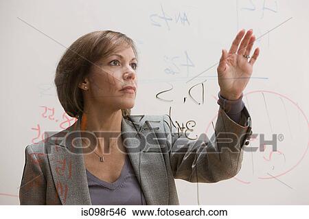 Businesswoman with diagram on glass View Large Photo Image Stock Photograph - Businesswoman with diagram on glass. Fotosearch