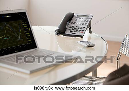 Laptop and telephone in office View Large Photo Image Stock Photo - Laptop and telephone in office. Fotosearch