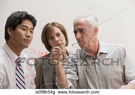 People drawing diagram on glass wall View Large Photo Image Stock Image - People drawing diagram on glass wall. Fotosearch