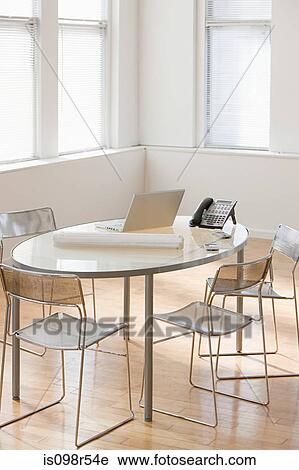 Table in an office View Large Photo Image Stock Image - Table in an office. Fotosearch