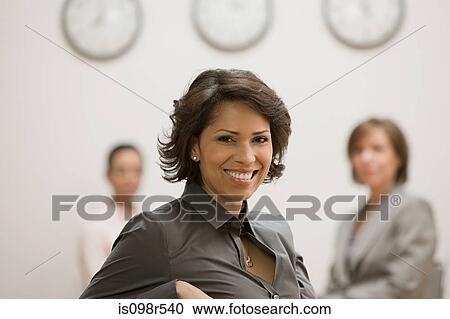 Stock Image - Woman and colleagues. Fotosearch