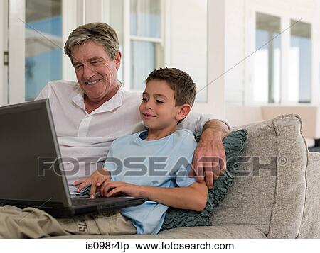 Boy and grandfather with laptop View Large Photo Image Stock Photography - Boy and grandfather with laptop. Fotosearch