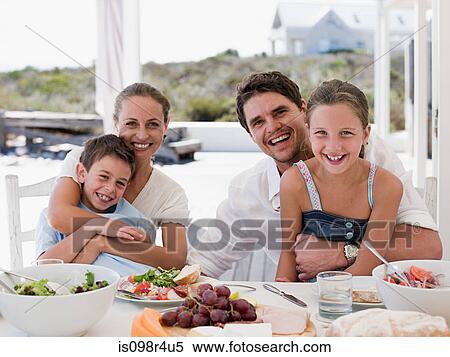 Stock Photography - Family meal outdoors. Fotosearch