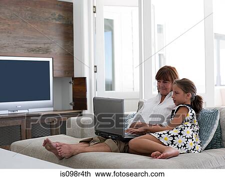 Girl and grandmother with laptop View Large Photo Image Stock Image - Girl and grandmother with laptop. Fotosearch