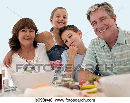 Grandparents and grandchildren at meal View Large Photo Image Stock Photo - Grandparents and grandchildren at meal. Fotosearch