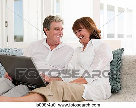 Senior couple with laptop View Large Photo Image Stock Image - Senior couple with laptop. Fotosearch