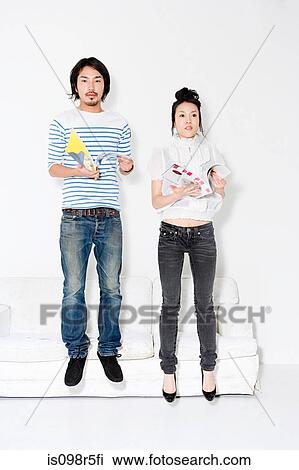 Couple with magazines View Large Photo Image Stock Image - Couple with magazines. Fotosearch