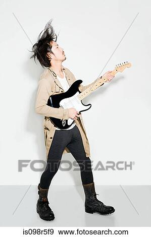 Man playing electric guitar View Large Photo Image Stock Photo - Man playing electric guitar. Fotosearch