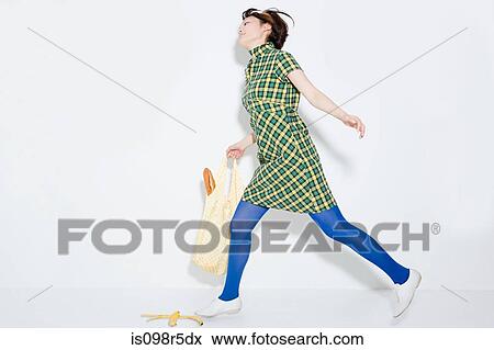 Woman about to slip on banana skin View Large Photo Image Stock Photo - Woman about to slip on banana skin. Fotosearch