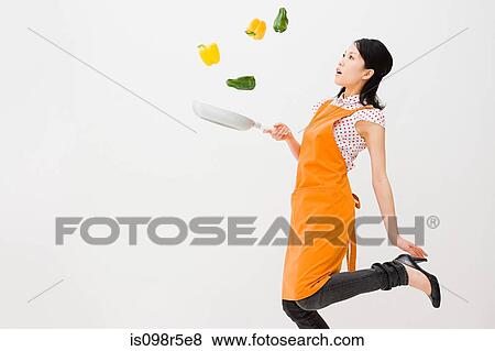 Woman tossing peppers View Large Photo Image Stock Photo - Woman tossing peppers. Fotosearch
