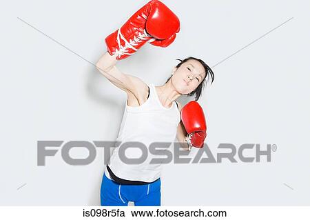 Young woman in boxing gloves View Large Photo Image Stock Image - Young woman in boxing gloves. Fotosearch