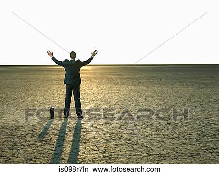 Businessman reaching to the sunlight View Large Photo Image Picture - Businessman reaching to the sunlight. Fotosearch