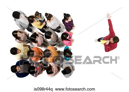 Man with loudspeaker in front of crowd View Large Photo Image Stock Photography - Man with loudspeaker in front of crowd. Fotosearch