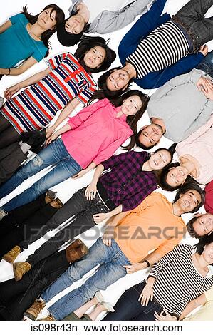 Picture - People lying together. Fotosearch
