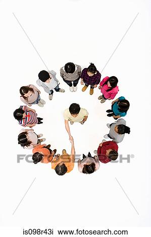 Stock Image - Person in circle shaking hands. Fotosearch