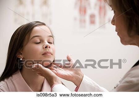 Doctor examining girl View Large Photo Image Stock Image - Doctor examining girl. Fotosearch