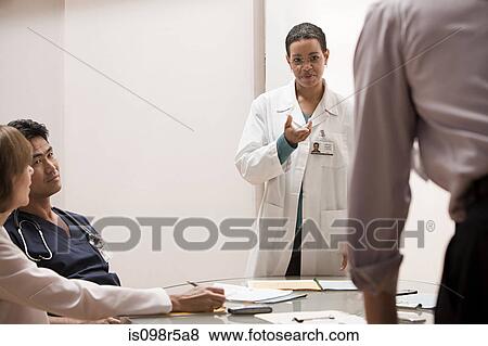 Doctor in meeting View Large Photo Image Stock Photo - Doctor in meeting. Fotosearch