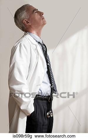 Doctor with eyes closed View Large Photo Image Stock Image - Doctor with eyes closed. Fotosearch