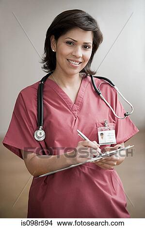 Picture - Doctor with medical notes. Fotosearch