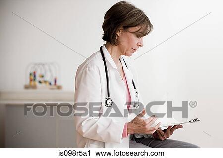 Doctor with medical notes View Large Photo Image Stock Image - Doctor with medical notes. Fotosearch