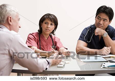 Doctors in a meeting View Large Photo Image Stock Image - Doctors in a meeting. Fotosearch