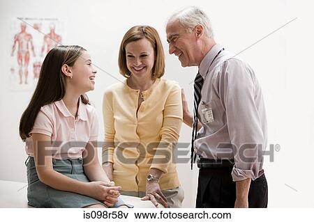 Girl and mother at doctors office View Large Photo Image Stock Photo - Girl and mother at doctors office. Fotosearch