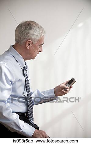 Man with cellphone View Large Photo Image Stock Image - Man with cellphone. Fotosearch