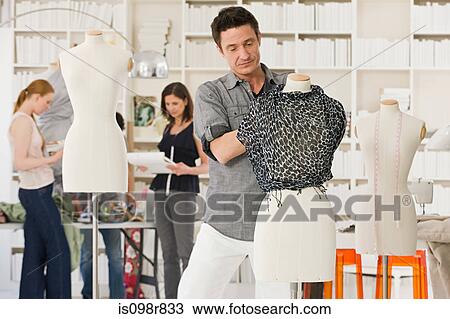 Fashion designers at work View Large Photo Image Stock Image - Fashion designers at work. Fotosearch