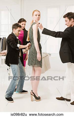 Fashion designers at work View Large Photo Image Stock Photograph - Fashion designers at work. Fotosearch