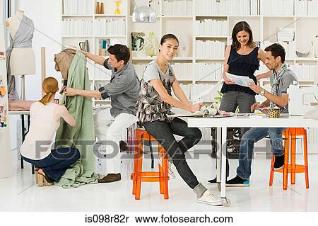 Stock Photography - Fashion designers at work. Fotosearch