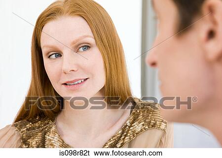 Stock Photograph - Woman looking at man. Fotosearch