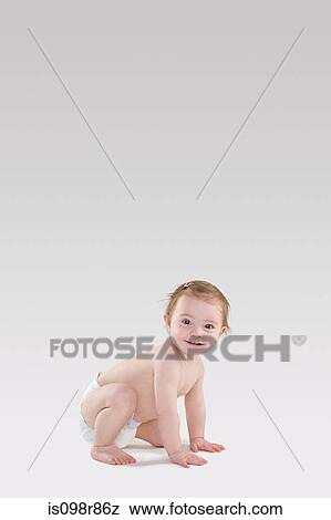 Stock Photo - Baby crouching. Fotosearch
