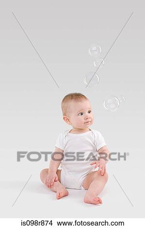 Baby looking at bubbles View Large Photo Image Picture - Baby looking at bubbles. Fotosearch