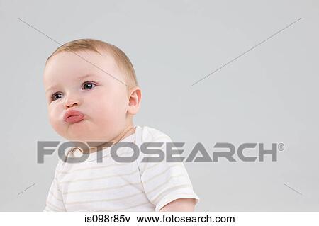Stock Photo - Baby making faces. Fotosearch