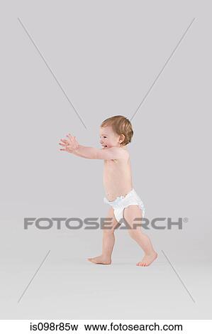 Baby walking View Large Photo Image Stock Photo - Baby walking. Fotosearch
