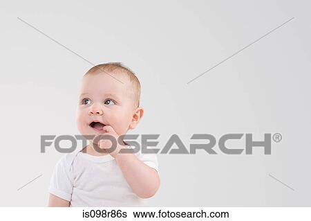 Baby with finger in mouth View Large Photo Image Stock Photograph - Baby with finger in mouth. Fotosearch
