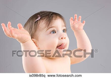 Baby with hands raised View Large Photo Image Stock Photography - Baby with hands raised. Fotosearch