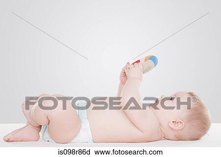 Baby with toy View Large Photo Image Stock Image - Baby with toy. Fotosearch