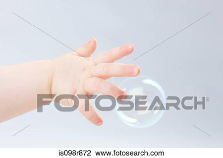 Hand of baby and bubble View Large Photo Image Stock Image - Hand of baby and bubble. Fotosearch