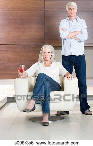 Middle aged couple with glass of wine View Large Photo Image Stock Photograph - Middle aged couple with glass of wine. Fotosearch