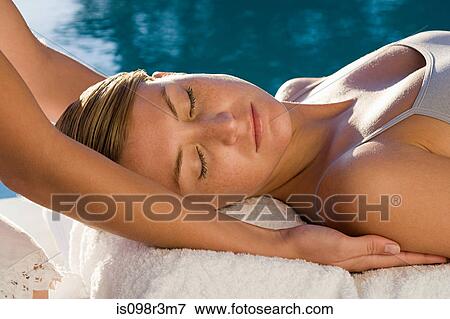 Young woman receiving massage View Large Photo Image Stock Photo - Young woman receiving massage. Fotosearch