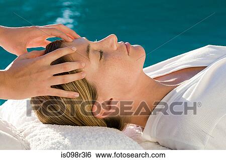 Young woman receiving massage View Large Photo Image Stock Photograph - Young woman receiving massage. Fotosearch