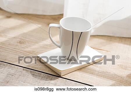 Coffee cup and a book View Large Photo Image Stock Image - Coffee cup and a book. Fotosearch