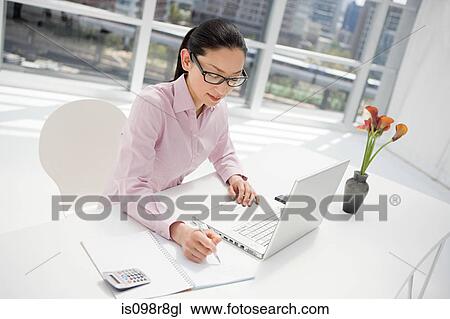 Japanese businesswoman at desk View Large Photo Image Stock Image - Japanese businesswoman at desk. Fotosearch