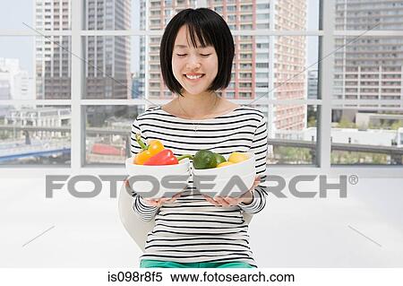 Japanese woman holding bowls of veg View Large Photo Image Stock Photography - Japanese woman holding bowls of veg. Fotosearch
