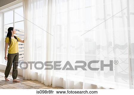 Japanese woman opening net curtains View Large Photo Image Stock Photography - Japanese woman opening net curtains. Fotosearch