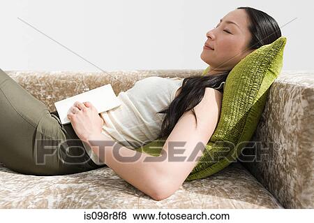 Japanese woman resting on sofa View Large Photo Image Stock Photo - Japanese woman resting on sofa. Fotosearch
