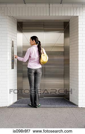 Japanese woman waiting for an elevator View Large Photo Image Stock Photo - Japanese woman waiting for an elevator. Fotosearch